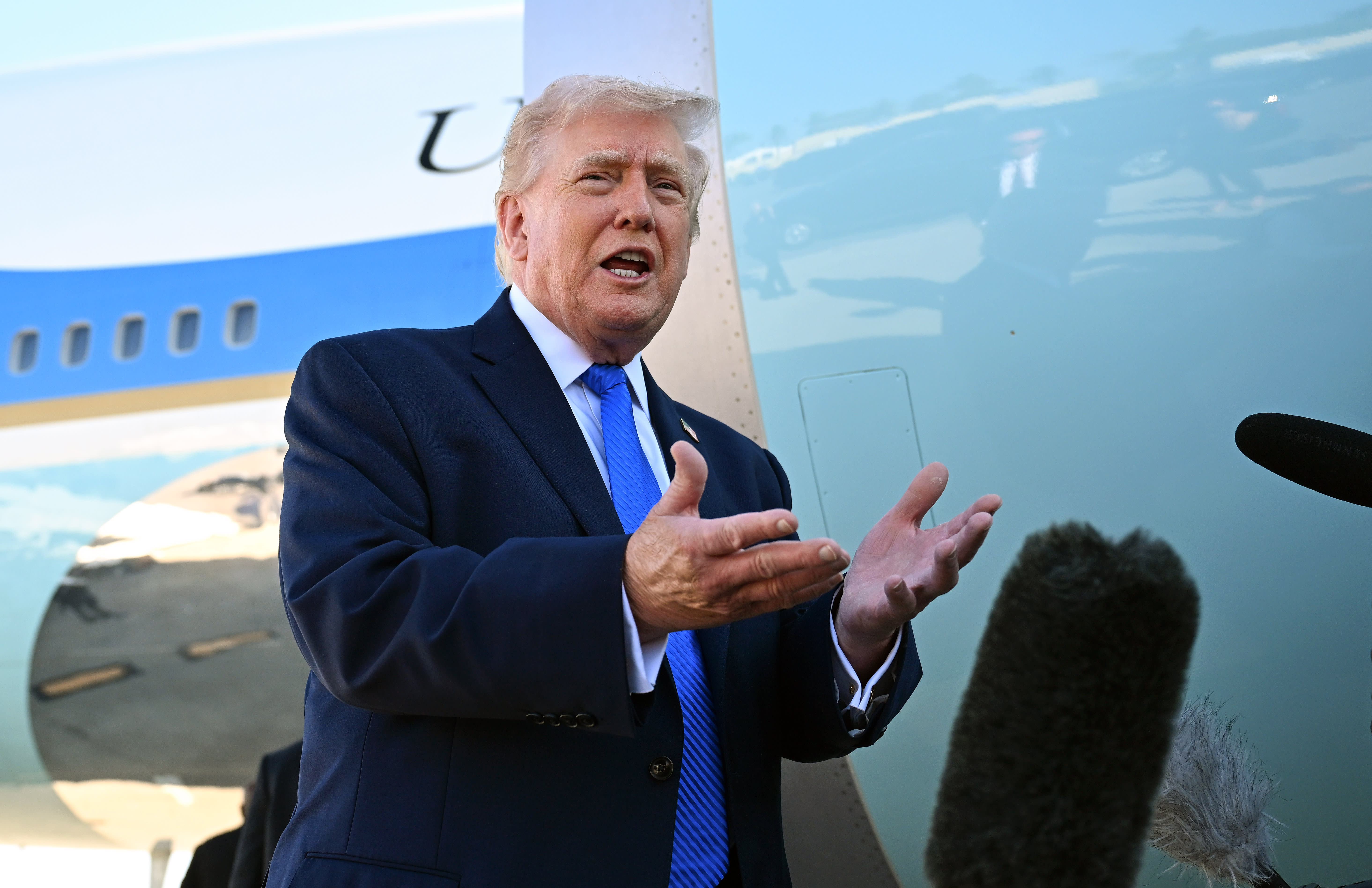 US President Donald Trump speaks to reporters before boarding Air Force One at Palm Beach International Airport on March 23, 2026 in West Palm Beach, Florida. (photo credit: Roberto Schmidt/Getty Images)