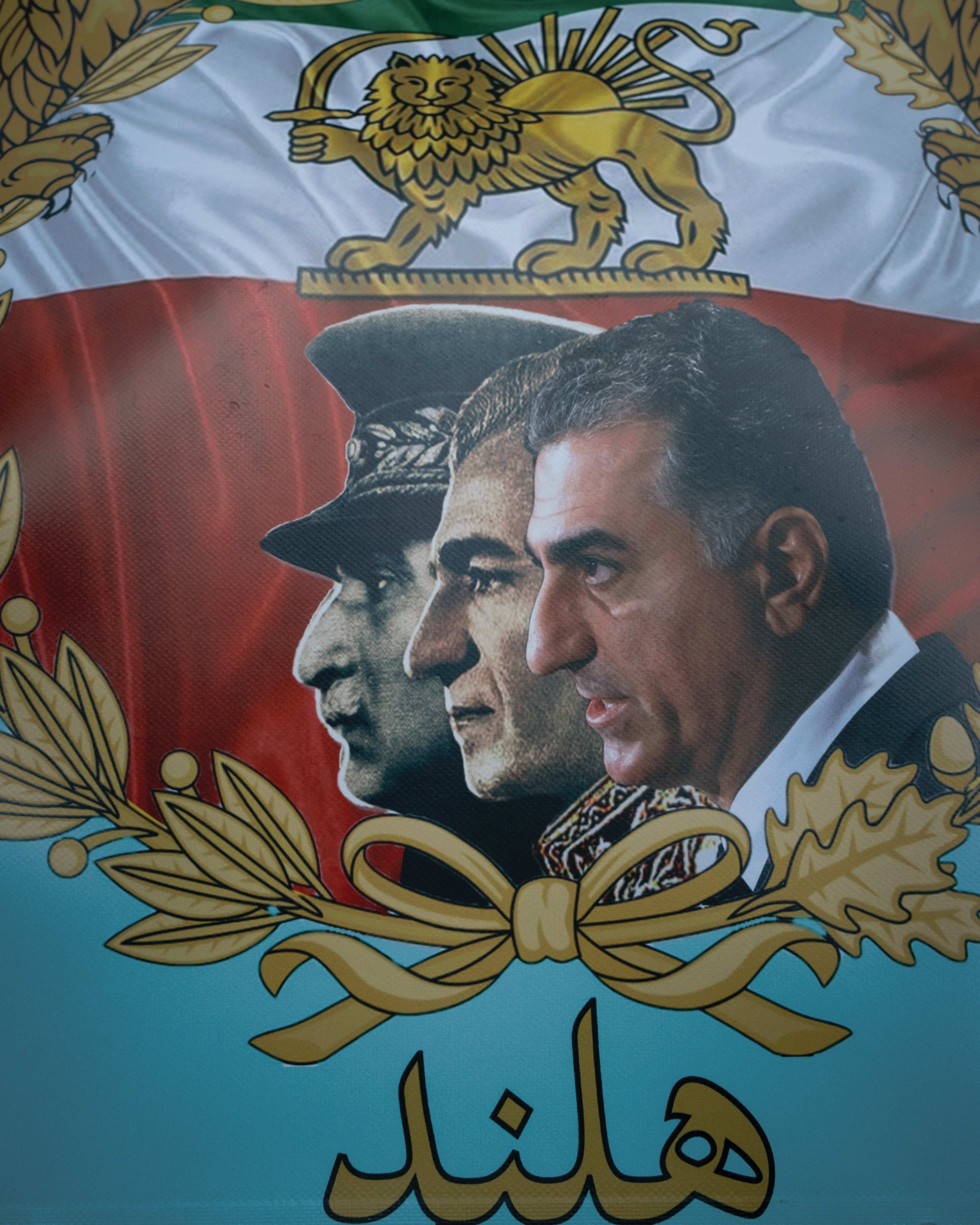 A poster featuring portraits of former Iranian monarchs alongside Reza Pahlavi is seen during a protest in The Hague, the Netherlands, last year. (photo credit: Giuseppe Pirrotta/Middle East Images/AFP via Getty Images)