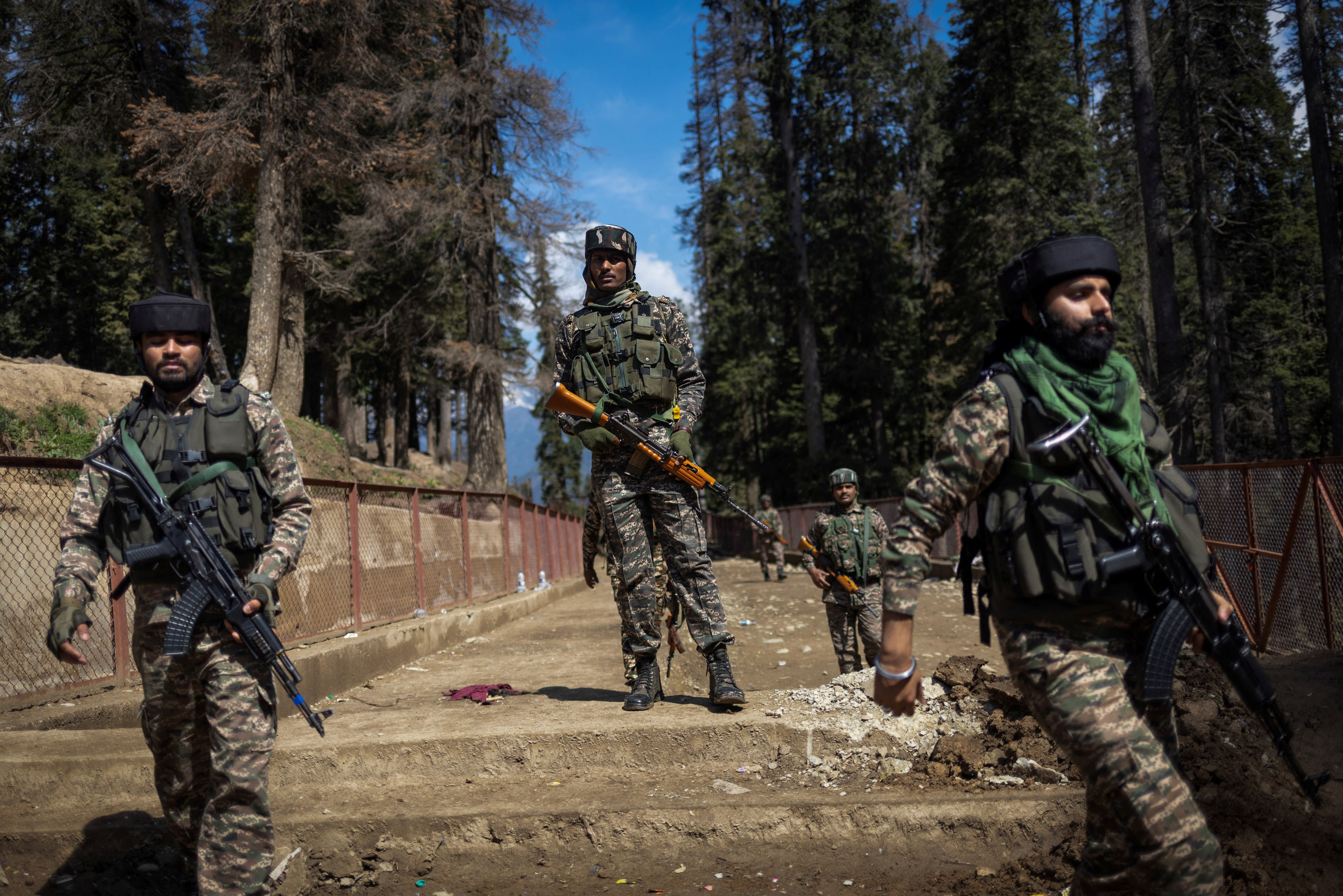 Indian security force personnel stand guard at the site of a suspected militant attack on tourists in Baisaran near Pahalgam in south Kashmir
