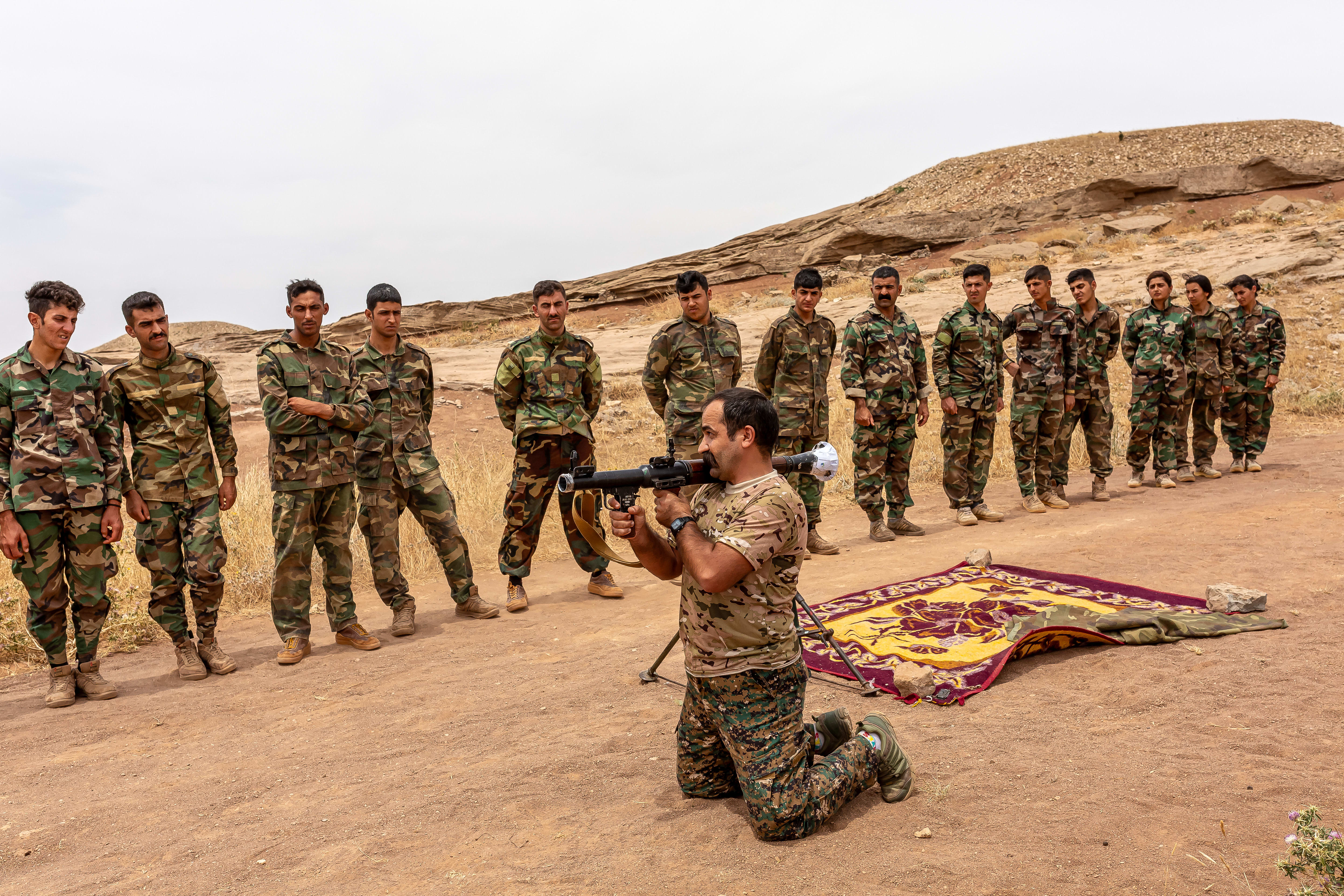  Members of the Kurdistan Democratic Party of Iran (KDPI) walk back to their outpost near Erbil, Kurdistan region of Iraq on Saturday, June 10, 2023. The KDPI, a leftist Kurdish group of Iran that has been running an armed struggle against the Islamic Republic