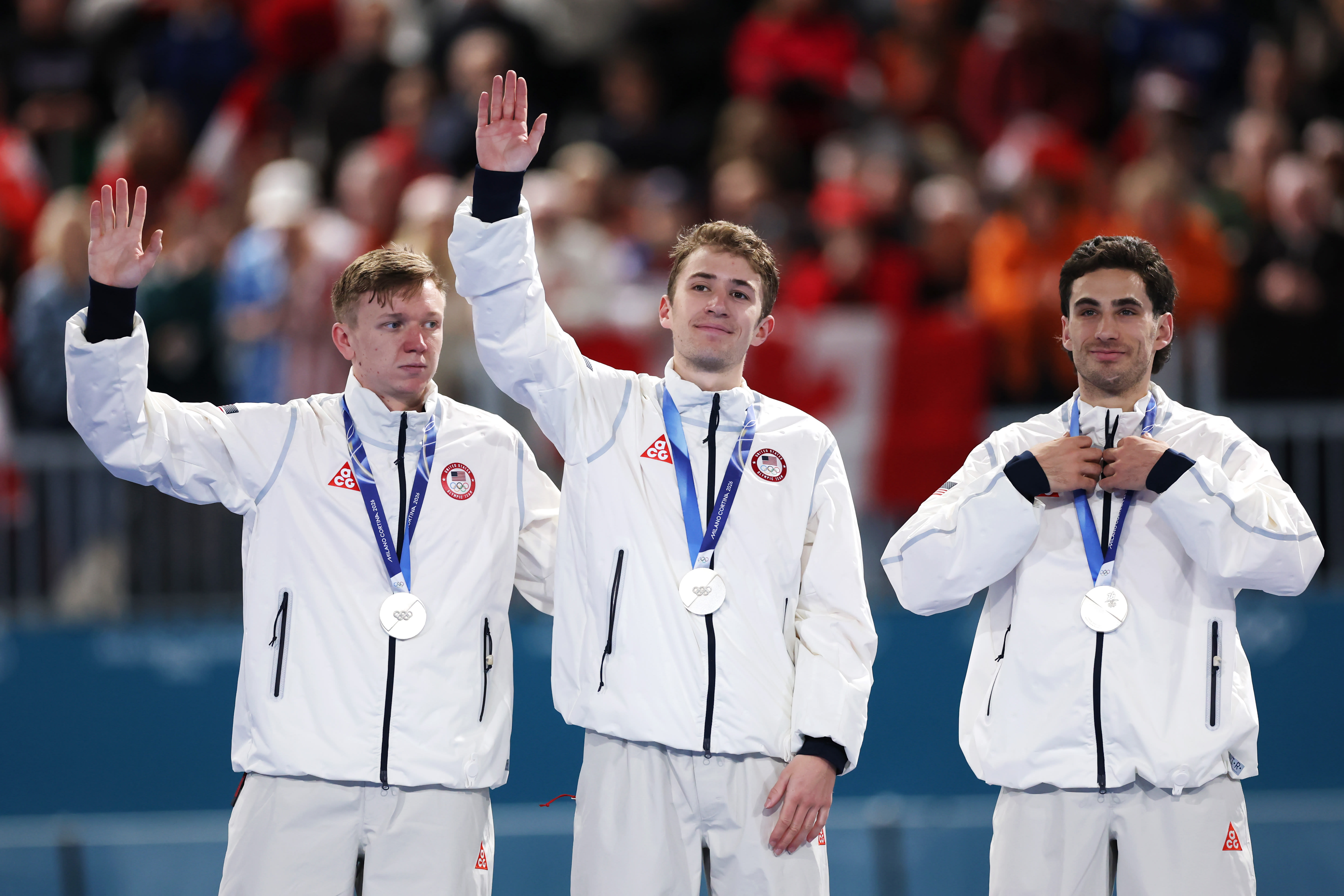 (L-R) Silver medalist Ethan Cepuran, Casey Dawson and Emery Lehman of Team United States celebrate on the podium during the medal ceremony for the Speed Skating Men (L-R) Silver medalist Ethan Cepuran, Casey Dawson and Emery Lehman of Team United States celebrate on the podium during the medal ceremony for the Speed Skating Men