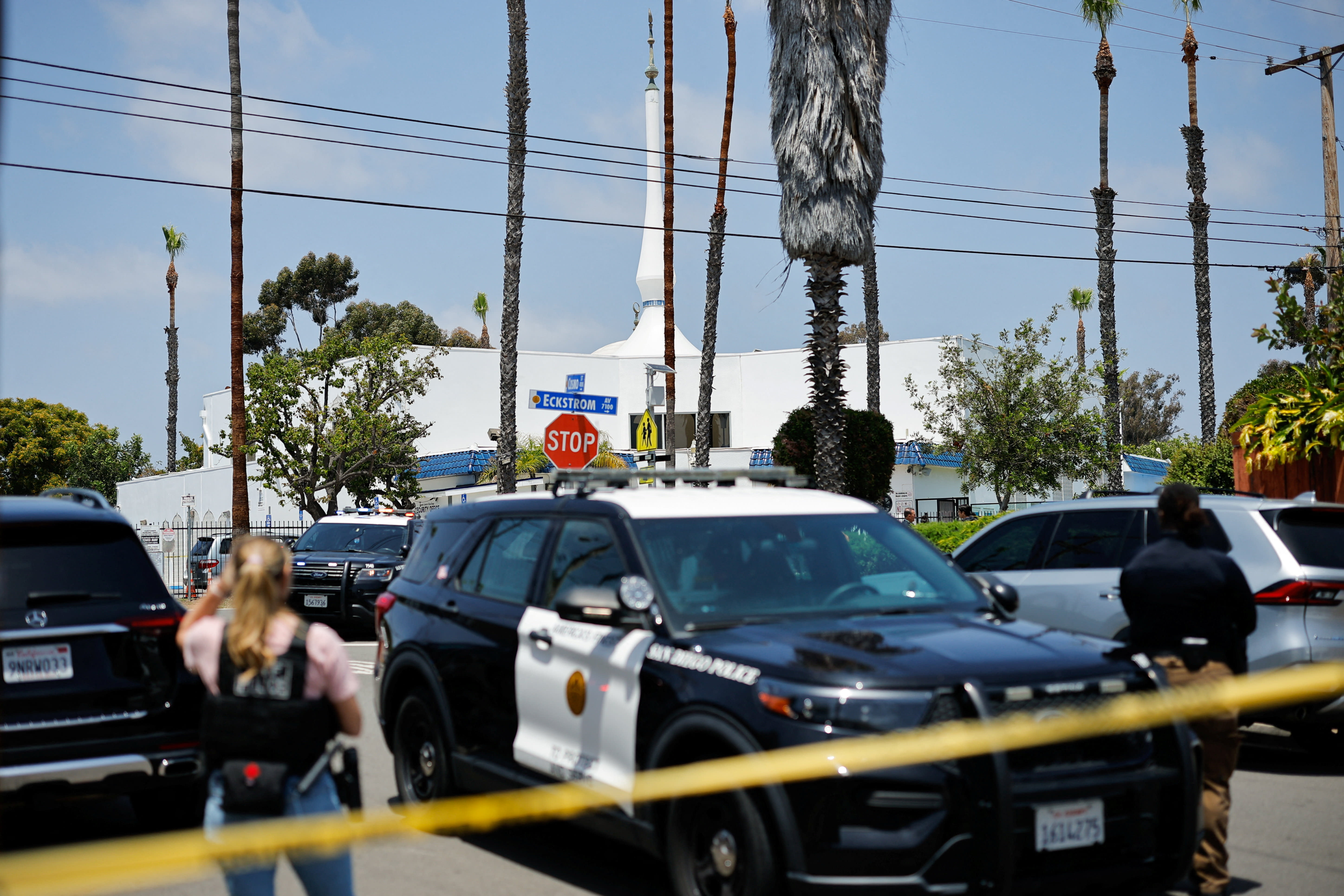 Emergency workers respond at the scene of a reported active shooter situation at the Islamic Center, with yellow tape to cordon the area in the foreground, in San Diego, California, US, May 18, 2026. (photo credit: REUTERS/MIKE BLAKE)