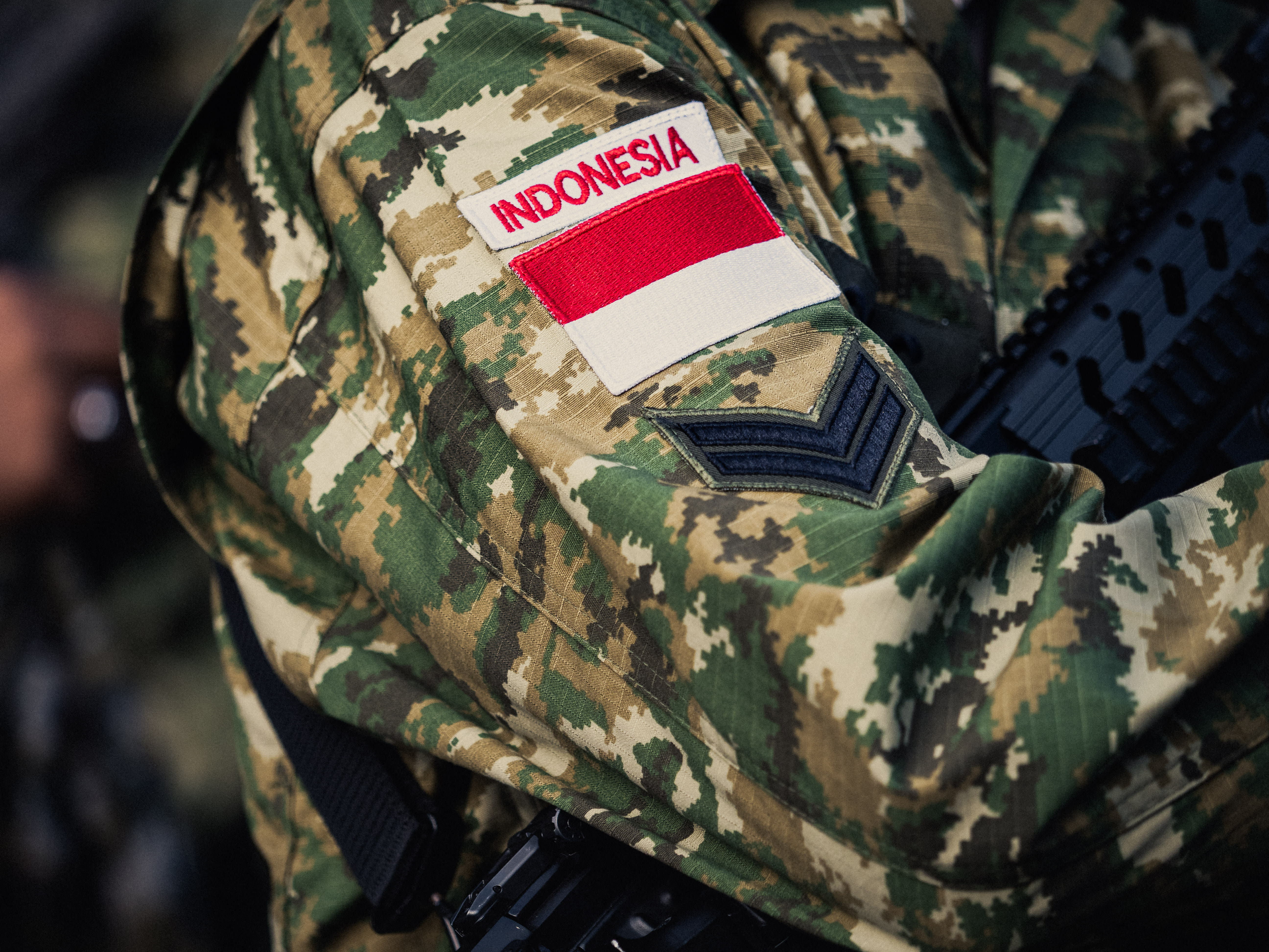 A patch with Indonesia and an Indonesian flag on the arm of an Indonesian soldier during the preparation of the annual Bastille Day military parade on the Champs Elysees avenue in Paris France on July 14, 2025.  (photo credit: BASTIEN OHIER/Hans Lucas/AFP via Getty Images)