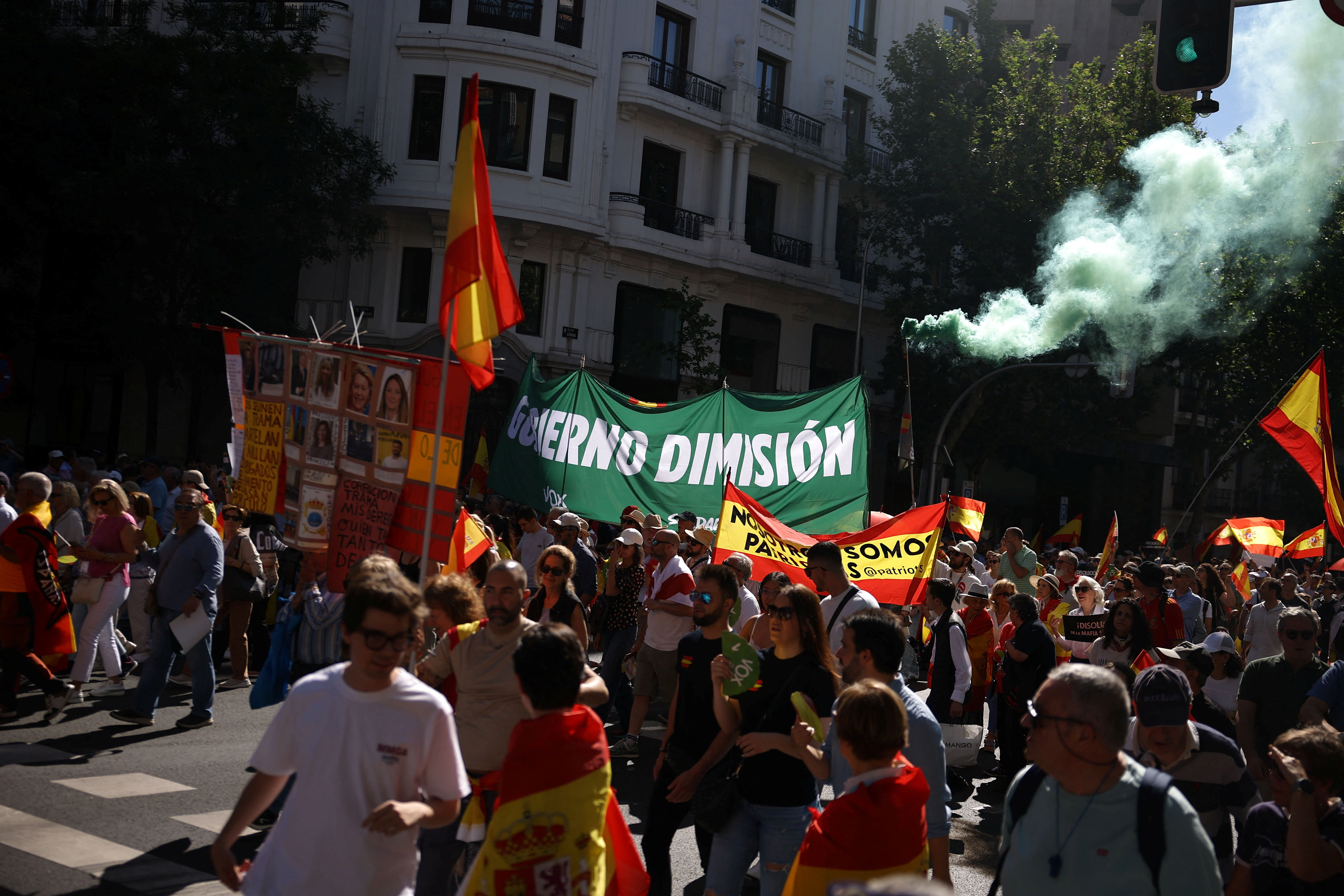 People take part in a rally organised by Spain’s far-right VOX party against Prime Minister Pedro Sanchez’s government, in Madrid, Spain, May 23, 2026. The banners reads 
