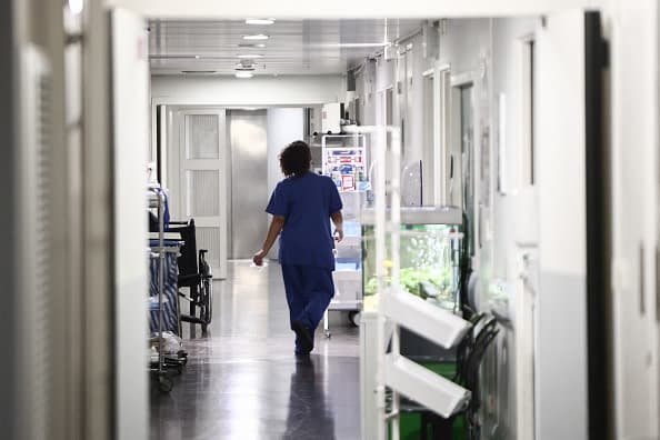 A nurse walks through the corridors of the sterile ward at the Timone pediatric hospital in Marseille on January 23, 2026. (Illustrative) (photo credit: Thibaud MORITZ / AFP via Getty Images)