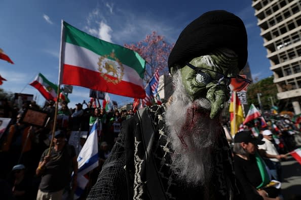 Placards are seen during a march in support of the people of Iran by members of the American-Iranian community in in Los Angeles on February 14, 2026. (photo credit: Patrick T. Fallon / AFP via Getty Images)
