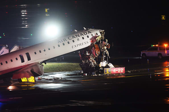 An Air Canada Express plane sits on the tarmac after it collided with a fire truck on the tarmac at LaGuardia Airport on March 23, 2026 in New York City. The plane had landed from a flight from Montreal.  (photo credit:  Spencer Platt/Getty Images)