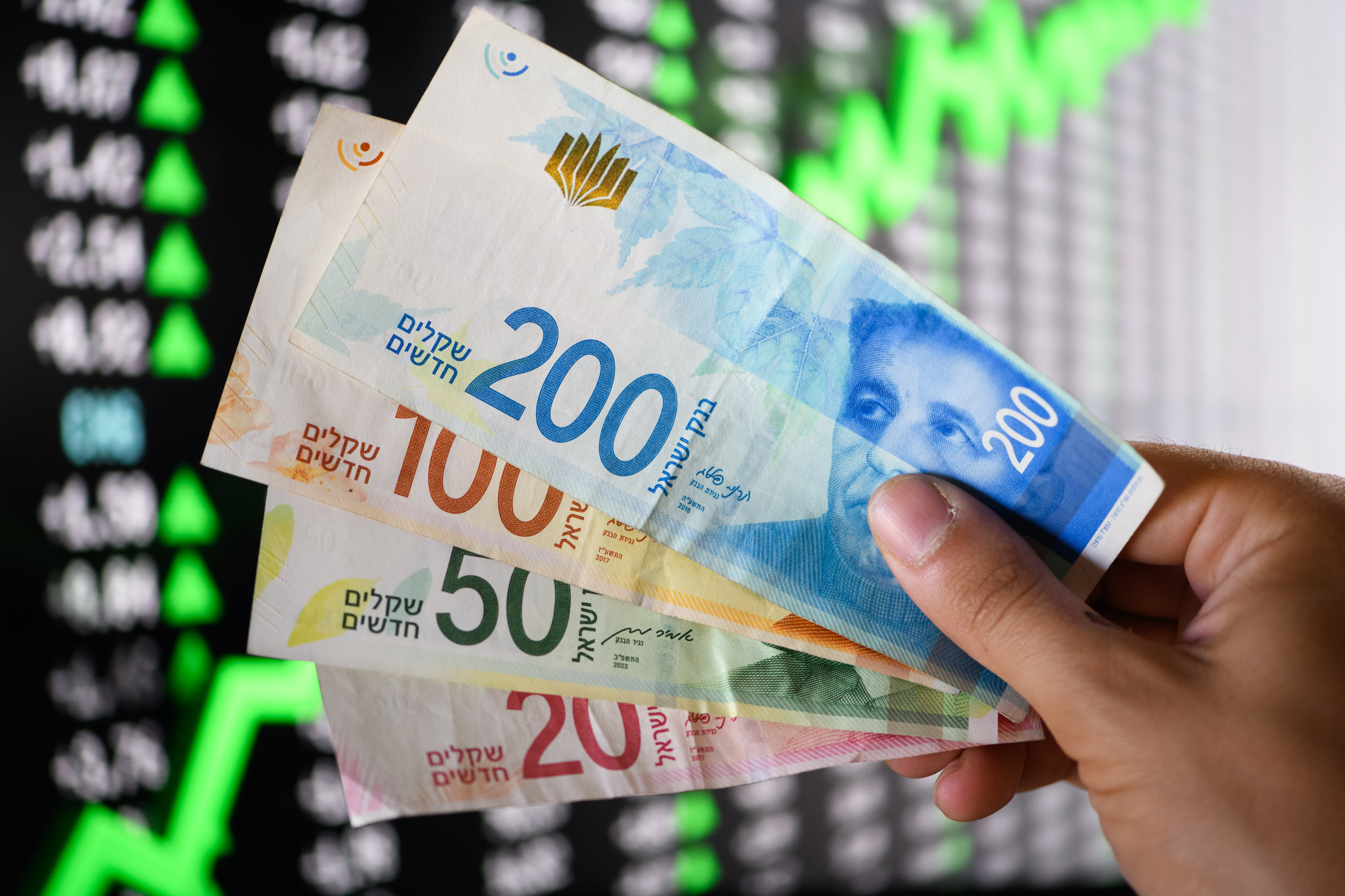  Illustration of  Israeli shekels, September 24, 2023 (photo credit: HADAR YOUAVIAN/FLASH90)