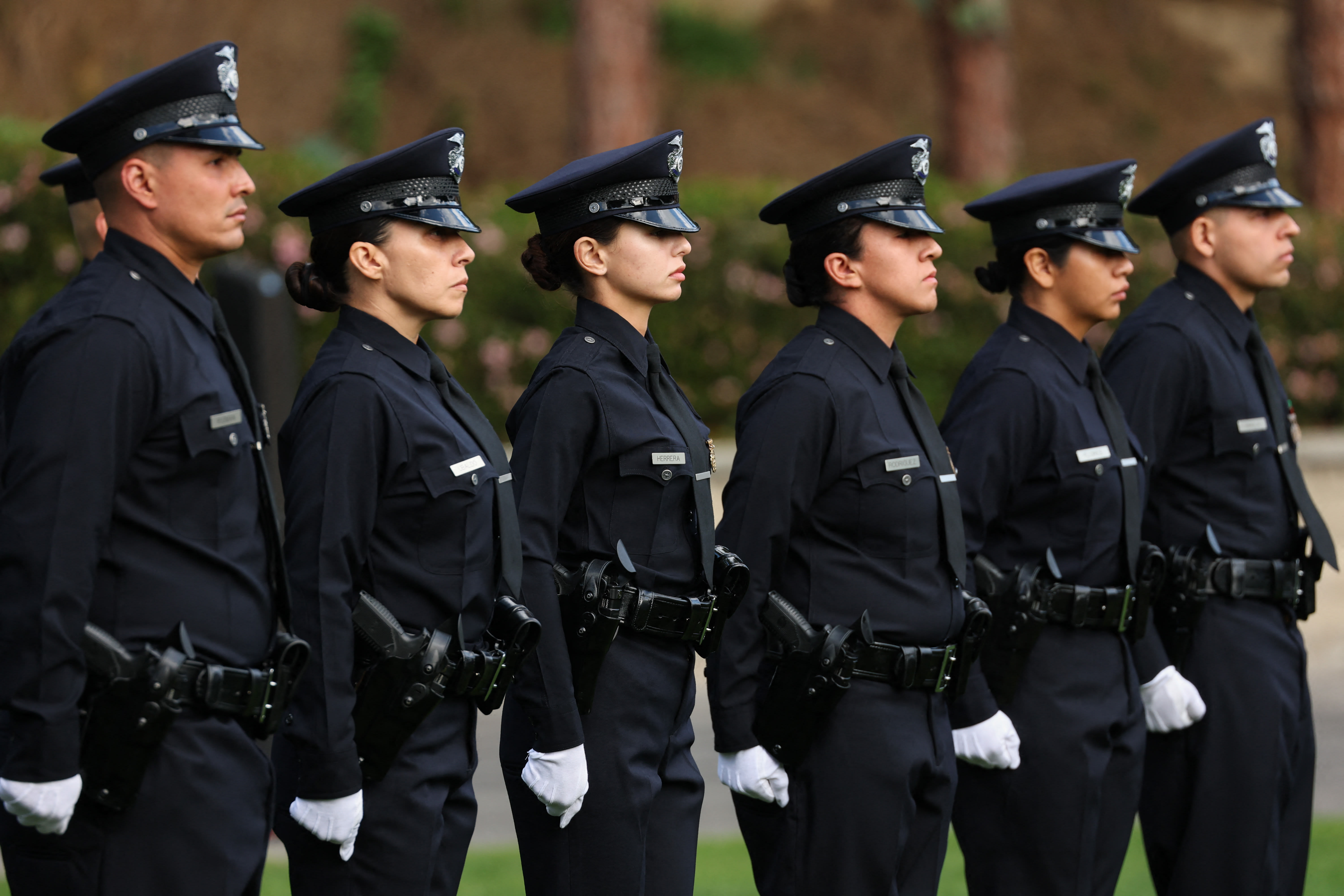 Los Angeles Police Department (LAPD) officer recruits from class 8-25 stand at attention during their graduation ceremony at the Los Angeles Police Academy in Los Angeles, California on February 6, 2026. (photo credit: Patrick T. Fallon / AFP via Getty Images)