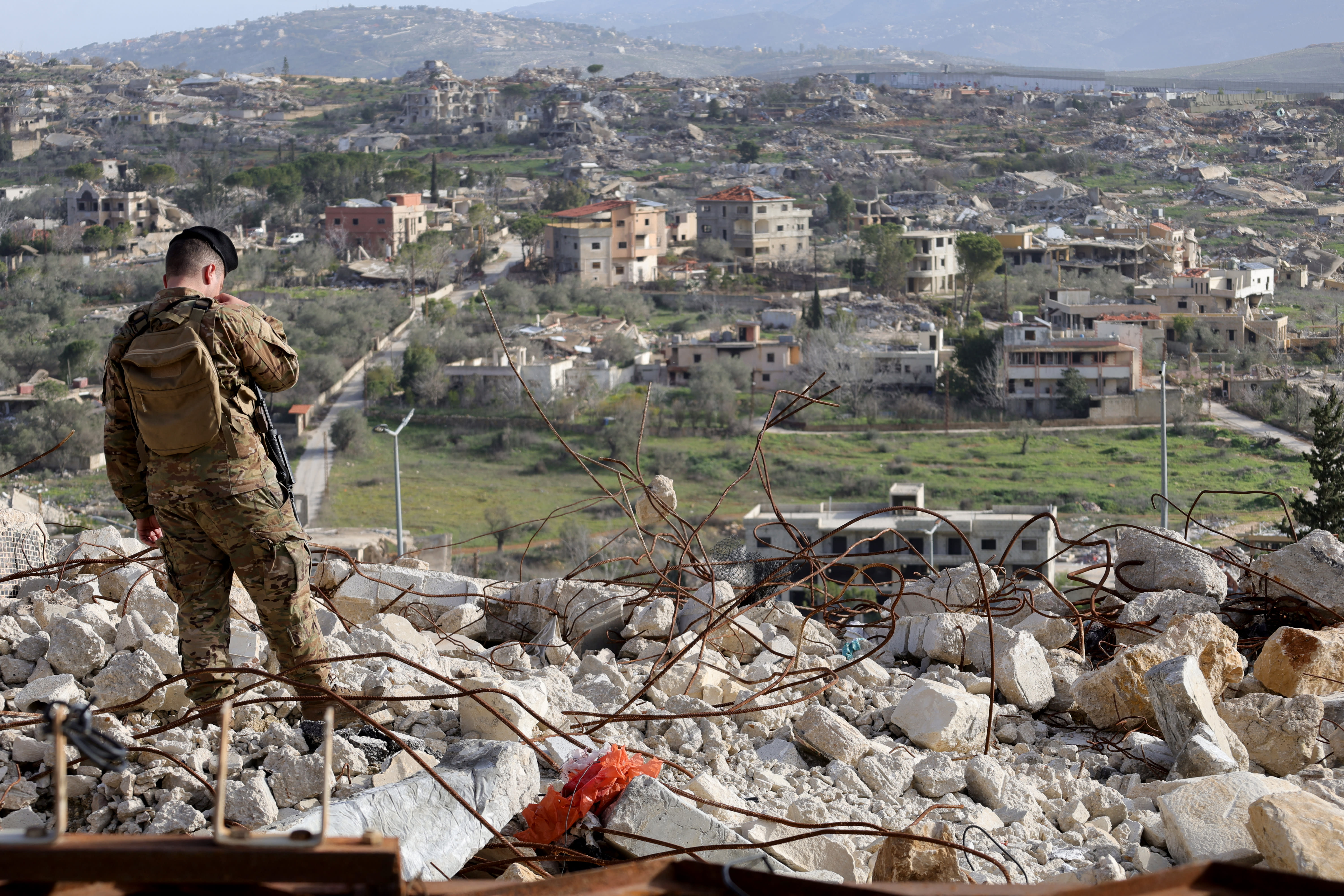 A member of the Lebanese military stands guard during a visit by Lebanon