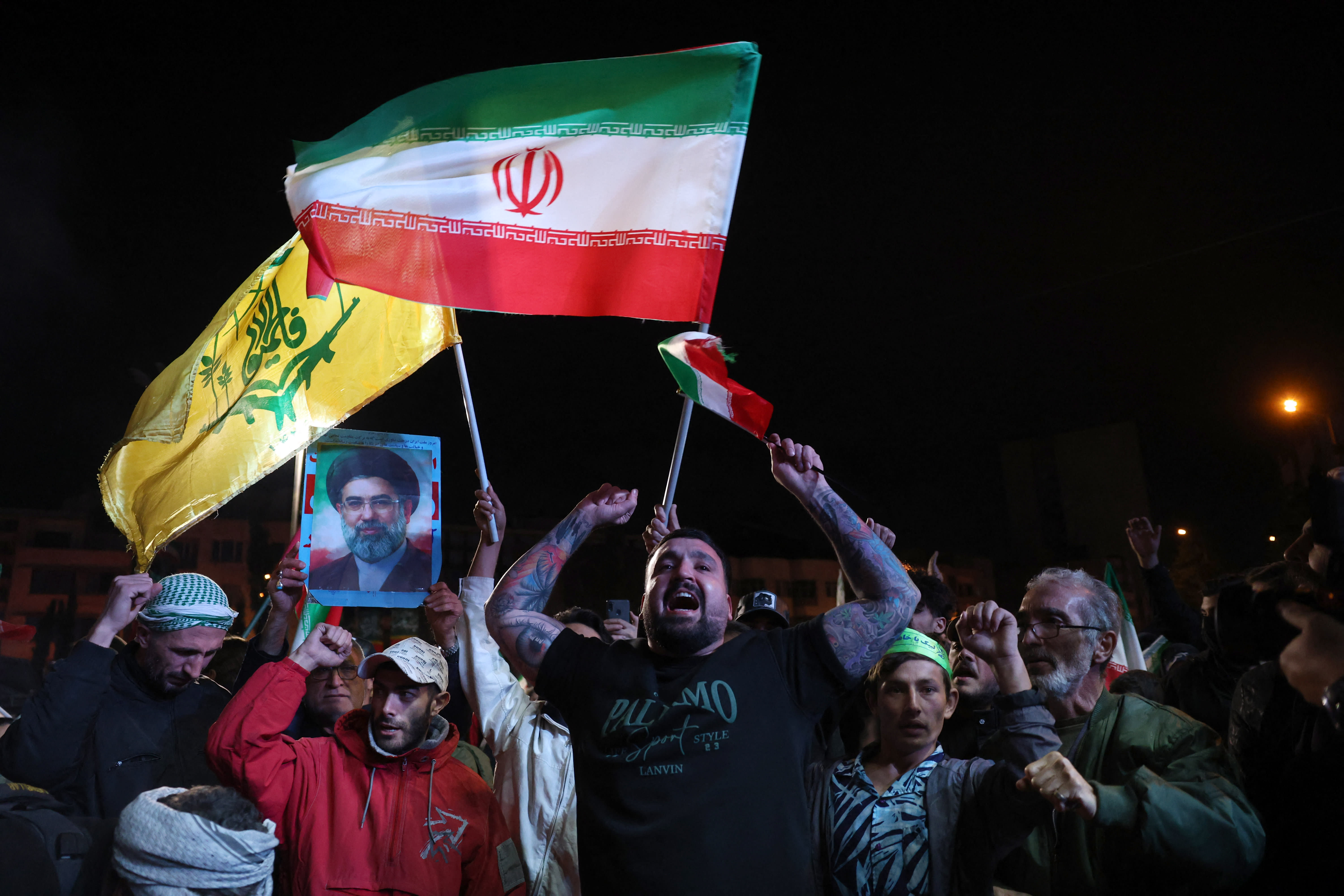 Iranians react after a ceasefire announcement at the Enqelab square, in Tehran, on April 8 2026. (photo credit: AFP VIA GETTY IMAGES)