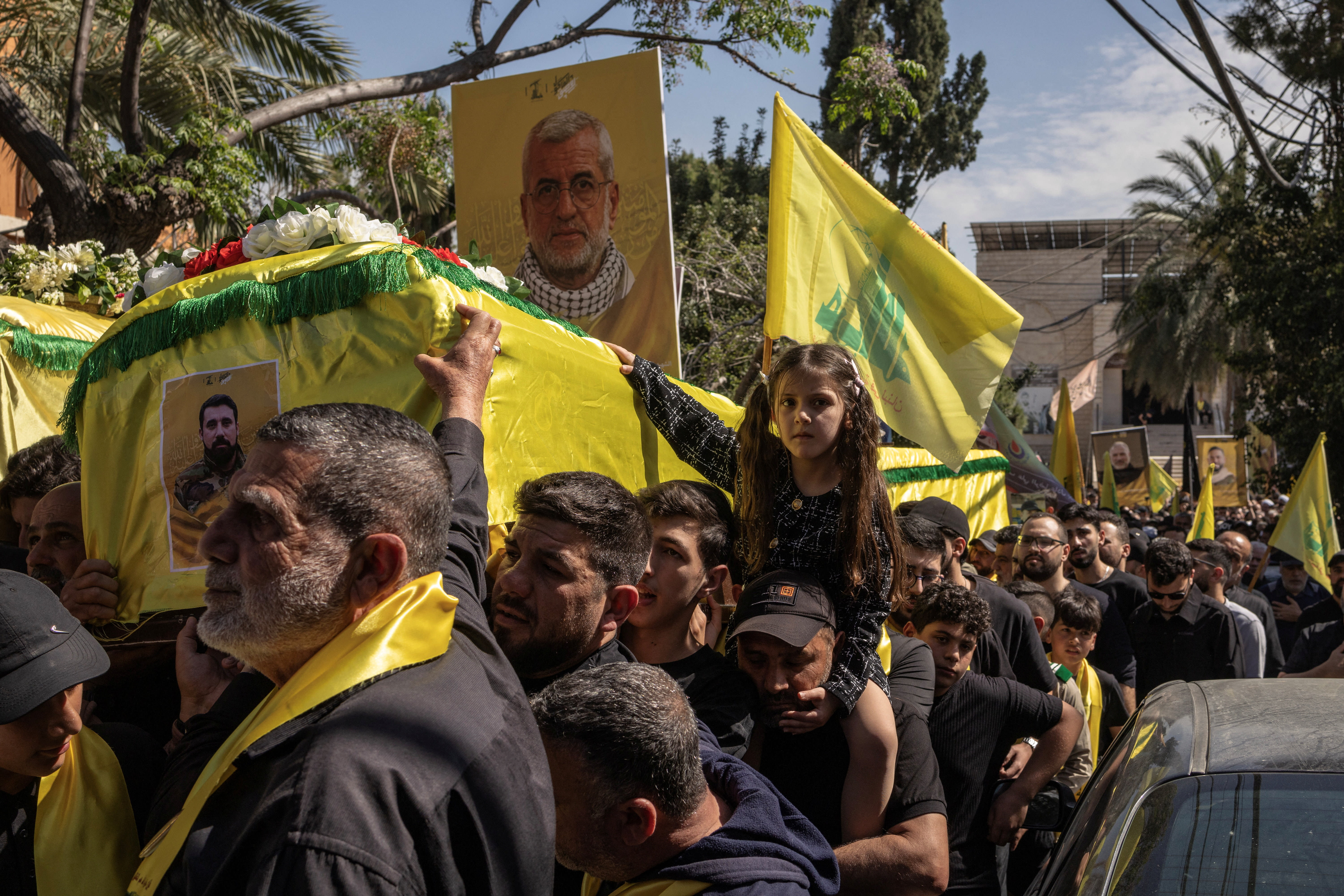 People carry the coffins of three Hezbollah terrorists during their funeral ceremony, amid a temporary ceasefire between Lebanon and Israel, in the village of Al-Halloussiyah, southern Lebanon, April 25, 2026. (photo credit: REUTERS/MARKO DJURICA)