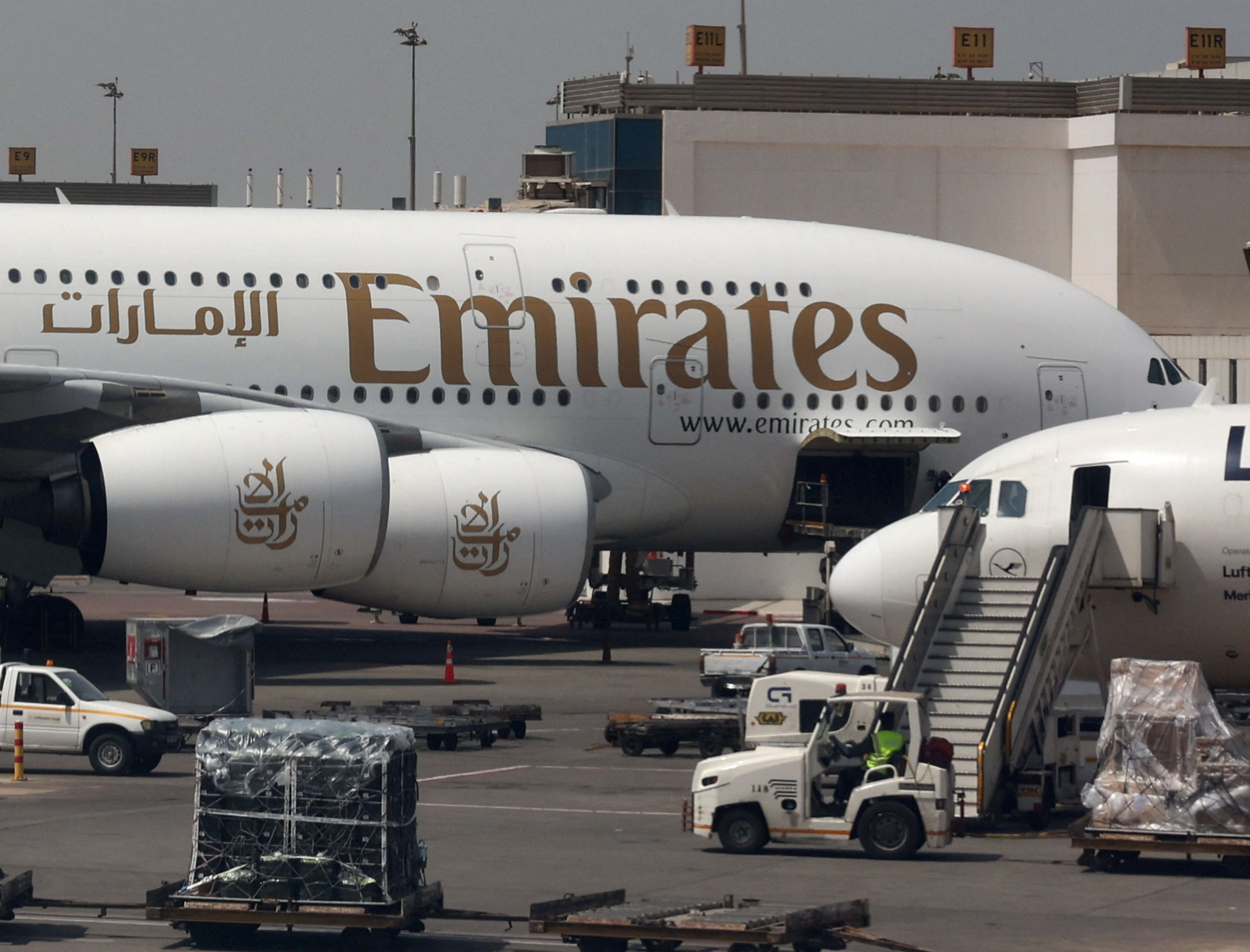 An Emirates aircraft is seen through the window of a Middle East Airlines airplane at Cairo International Airport, March 31, 2026; illustrative. (photo credit: REUTERS/AMR ABDALLAH DALSH)