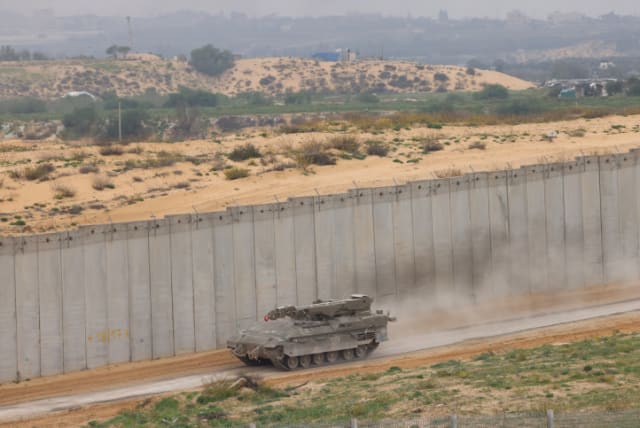  A military vehicle drive on the Israeli border with the Gaza Strip, on December 21, 2023 (photo credit: YOSSI ZAMIR/FLASH90)