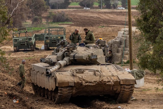  Israeli soldiers seen at a staging area near the Israeli-Gaza border, southern Israel, January 21, 2024 (photo credit: Chaim Goldberg/Flash90)