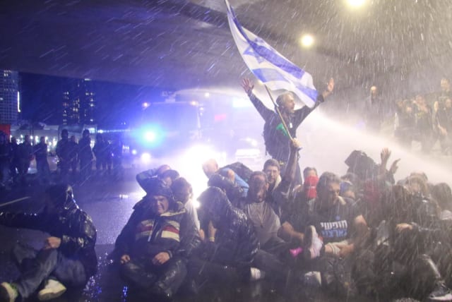  Israel Police use water cannons on protesters in Tel Aviv, March 9, 2024 (photo credit: ARIELLE SKLADMAN)