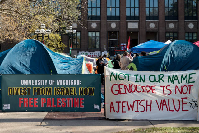  A coalition of University of Michigan students camp at an encampment in the Diag to pressure the university to divest its endowment from companies that support Israel or could profit from the ongoing conflict between Israel and Hamas on the University of Michigan college campus in Ann Arbor. (photo credit: REUTERS/REBECCA COOK)