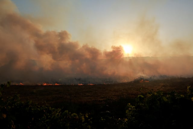  Smoke rises as flames burn, amid ongoing cross-border hostilities between Hezbollah and Israeli forces, in Dishon, near Kiryat Shmona, northern Israel, June 4, 2024. (photo credit: REUTERS/AMMAR AWAD)