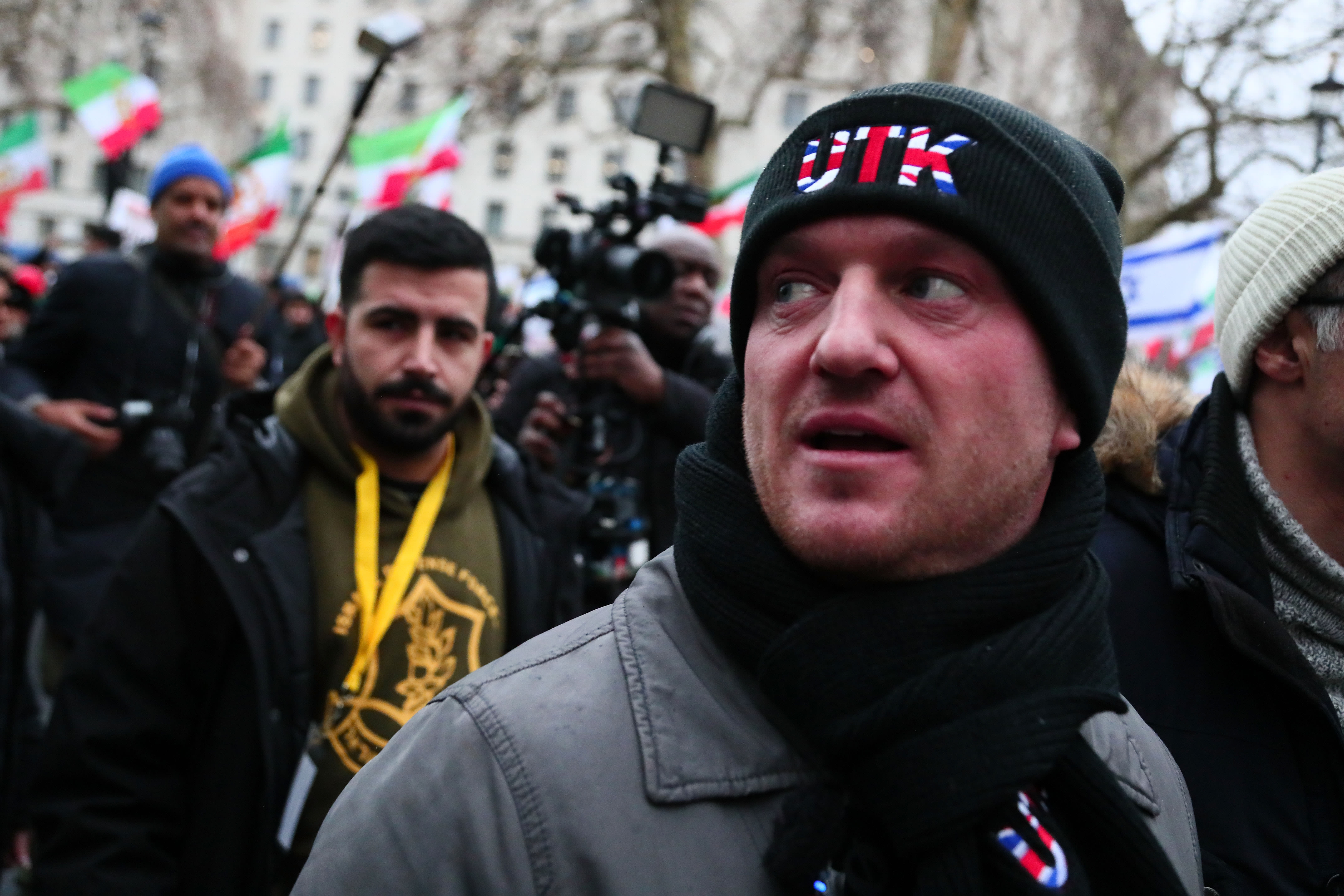 Tommy Robinson wears a UTK logo ("Unite The Kingdom") on his clothes as he is seen at a rally in solidarity with protesters in Iran on January 11, 2026 in London, England.  (photo credit: Alishia Abodunde/Getty Images)