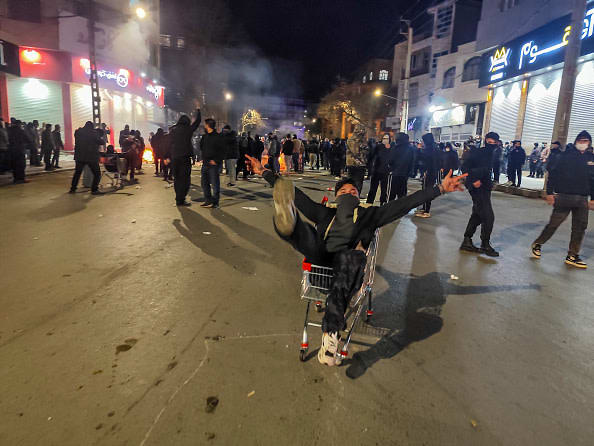 Iranians gather while blocking a street during a protest in Kermanshah, Iran on January 8, 2026.  (photo credit:  Kamran / Middle East Images / AFP via Getty Images)