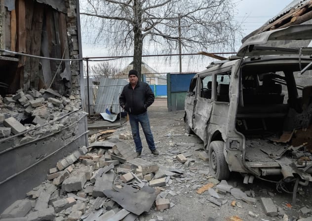 A MAN inspects his house, which was damaged by recent shelling, in the government-held village of Novoluhanske, Ukraine.