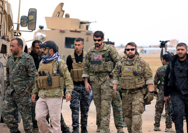 Syrian Democratic Forces and U.S. troops are seen during a patrol near Turkish border in Hasakah, Syria November 4, 2018