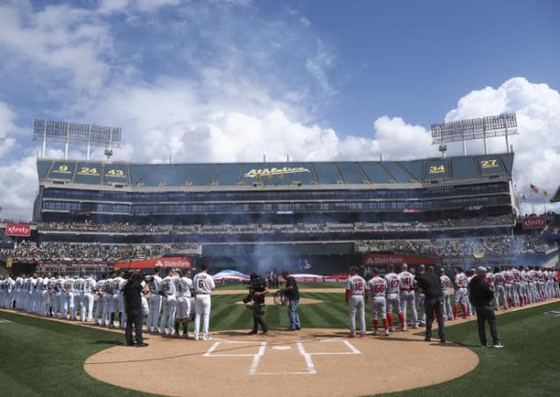 Mar 28, 2019; Oakland, CA, USA; Oakland Athletics and Los Angeles Angels players line up before the game at Oakland Coliseum