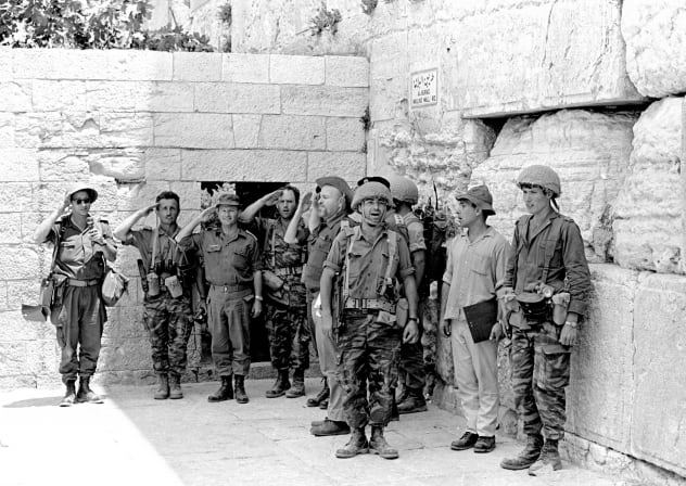 IDF SOLDIERS stand at the Western Wall in June 1967 after it was captured during the Six Day War.