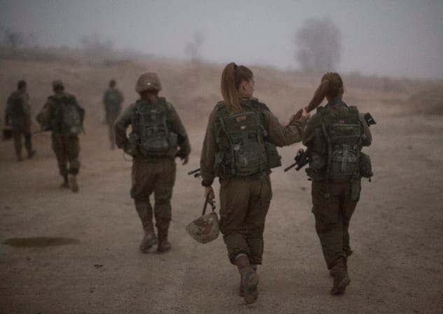 Female soldiers of the Bardales Battalion preparing for urban warfare training, near Nitzanim in the Arava area of Southern Israel. 