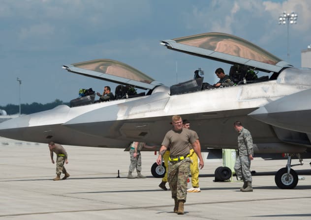  US Air Force pilots and aircraft mechanics of the 325th Fighter Wing secure F-22 Raptor aircraft relocating due to Hurricane Laura, shortly after their arrival at Wright-Patterson Air Force Base, Ohio, US August 23, 2020.