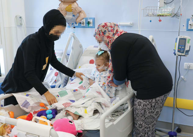   A PALESTINIAN girl from Hebron hospitalized at the Sylvan Adams Children’s Hospital at Wolfson Medical Center in Holon, after undergoing cardiac surgery. Together with her are her mother and the mother of her little roommate, also from Hebron.
