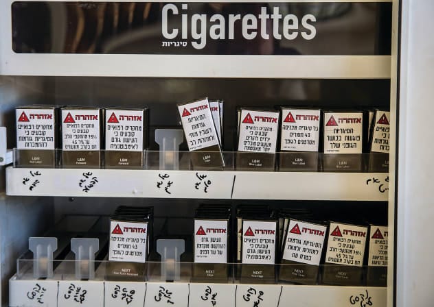  CIGARETTES ON display at a convenience store in Safed carry warnings that smoking causes cancer, heart disease, stroke and other harm to smokers and their children. 
