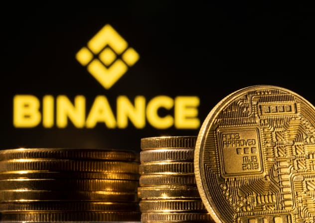  A representation of the cryptocurrency is seen in front of Binance logo in this illustration taken, March 4, 2022. 