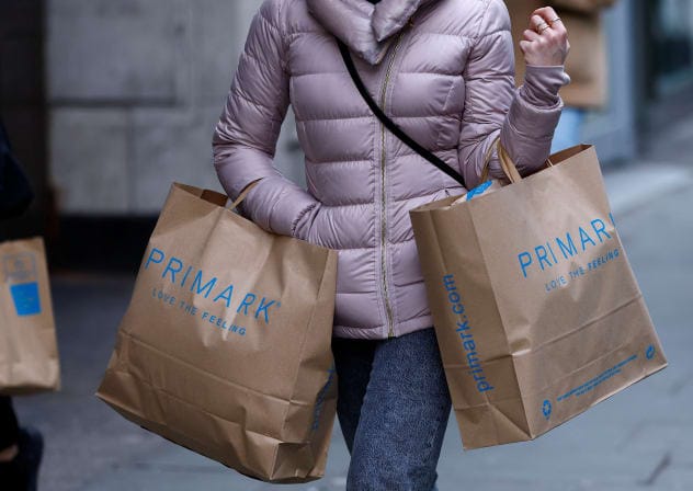 A woman carries Primark shopping bags on Oxford Street, in London, Britain, January 16, 2023. 