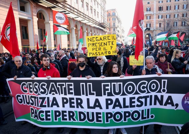  Pro-Palestinian protestors hold a banner during a demonstration demanding an immediate ceasefire in Gaza, as the conflict between Israel and the Palestinian Islamist group Hamas continues, in Rome, Italy, January 27, 2024. The banner reads: "Cease fire! Justice for Palestine, peace for two peoples