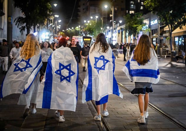  People walk on Jaffa street in Jerusalem, during Israel's 76th Independence Day celebrations, May 13, 2024.