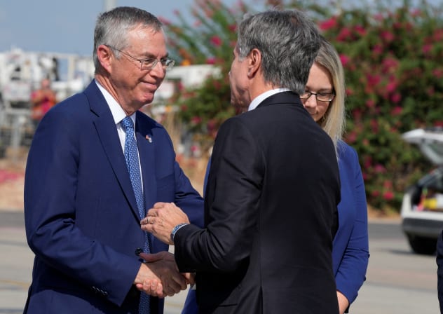 Ambassador to U.S. Michael Herzog welcomes Secretary of State Antony Blinken upon his arrival at Ben Gurion Airport in Tel Aviv, Israel, Thursday Oct. 12, 2023.