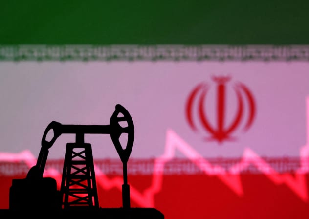  Iranian flag with stock graph and an oil pump jack miniature model are seen in this illustration taken October 9, 2023.