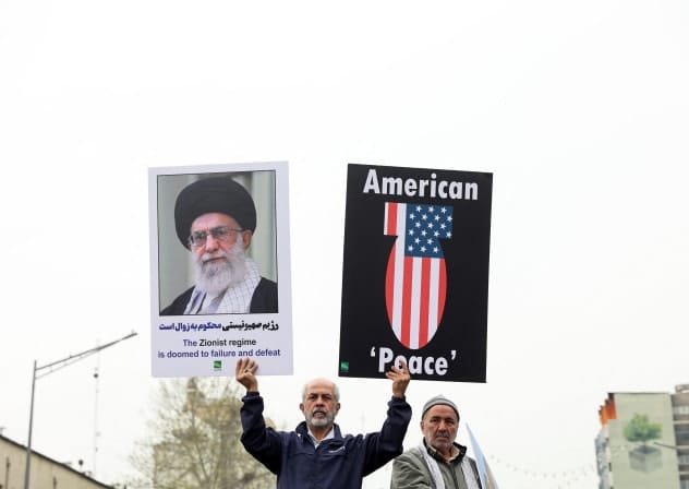 Iranians hold banners during the annual al-Quds Day in Tehran, Iran, March 28, 2025