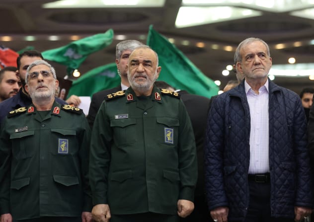  Iranian President Masoud Pezeshkian and Islamic Revolutionary Guard Corps (IRGC) Commander-in-Chief Major General, Hossein Salami and Brigadier General Esmail Qaani, the head of the Revolutionary Guards' Quds Force, attend a ceremony. 