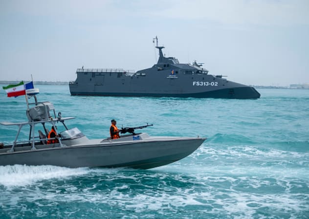  IRGC Navy Martyr Hassan Bagheri warship and an IRGC speed boat are sailing along the Persian Gulf during the IRGC marine parade, on April 29, 2024.