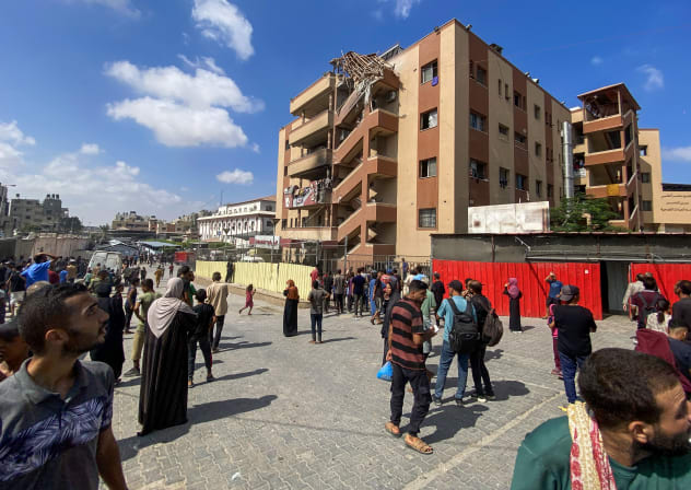 Crowds gather in the aftermath of an Israeli strike on Khan Yunis's Nasser Hospital, August 25, 2025.