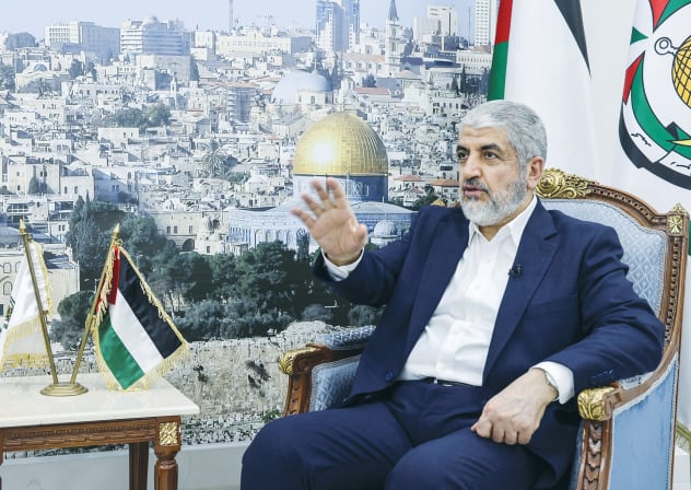 HAMAS TERRORIST KHALED MASHAAL speaks during an interview in Doha.