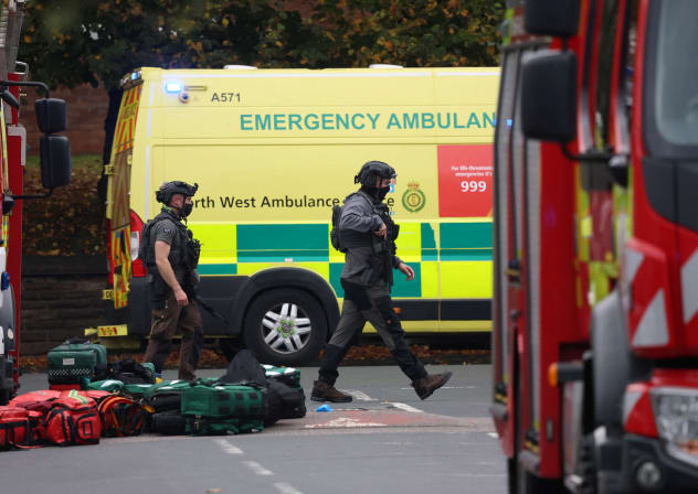Emergency personnel work at the scene, after a report of an incident in which a car was driven at pedestrians and a stabbing attack, near a synagogue in north Manchester, Britain, October 2, 2025