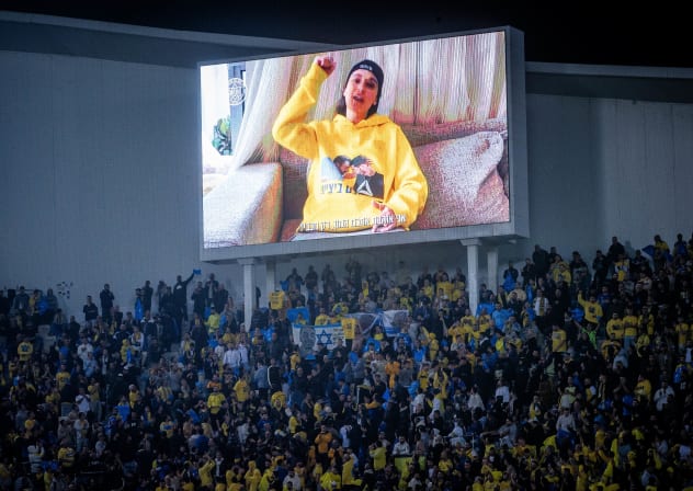 EMILY DAMARI speaks via video at a match between Beitar Jerusalem and Maccabi Tel Aviv at Bloomfield Stadium in Jaffa in February after her release from captivity in Gaza. On the Aston Villa ban, she says it’s like putting a sign on a stadium that reads, ‘No Jews allowed.’ 