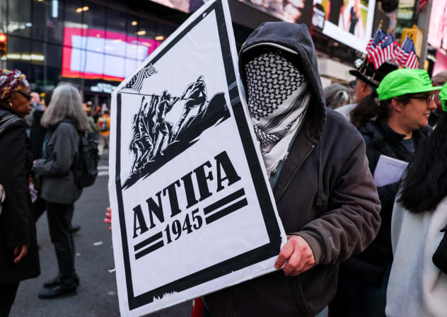 A demonstrator holds an "antifa" placard at a "No Kings" protest against US President Donald Trump's policies, in Times Square in New York City, US, October 18, 2025; illustrative.
