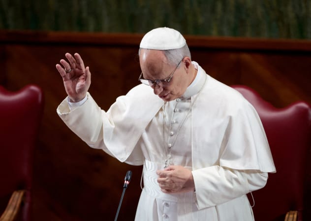 Pope Leo XIV performs a blessing during a meeting with the academic community of Pontifical Lateran University in Rome, Italy, November 14, 2025. 