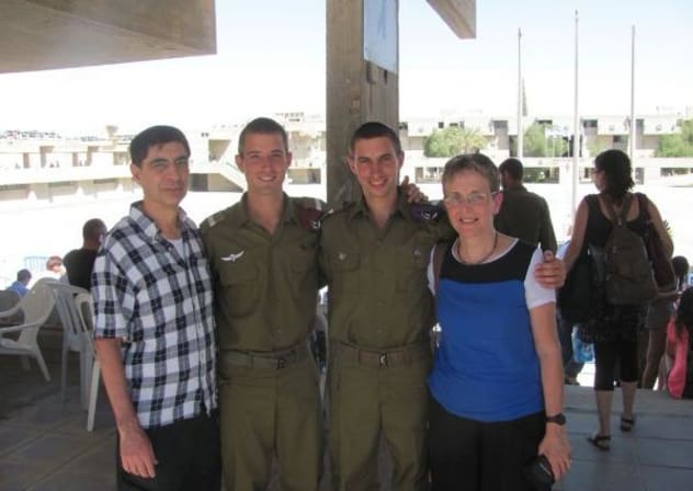 Hadar and Tzur Goldin (center) with their parents Simha and Leah.