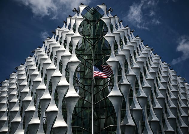 A photograph taken on June 22, 2025 shows the American flag flapping in the air at US Embassy, south London. 
