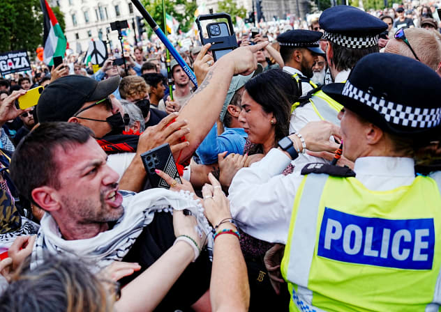 POLICE OFFICERS stand guard as demonstrators attend the "Lift The Ban" rally organised by Defend Our Juries, challenging the British government's proscription of "Palestine Action" under anti-terrorism laws, in Parliament Square, in London, Britain, September 6, 2025.